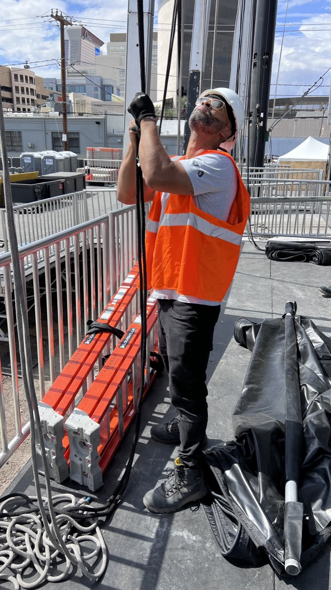 William working with production cabling